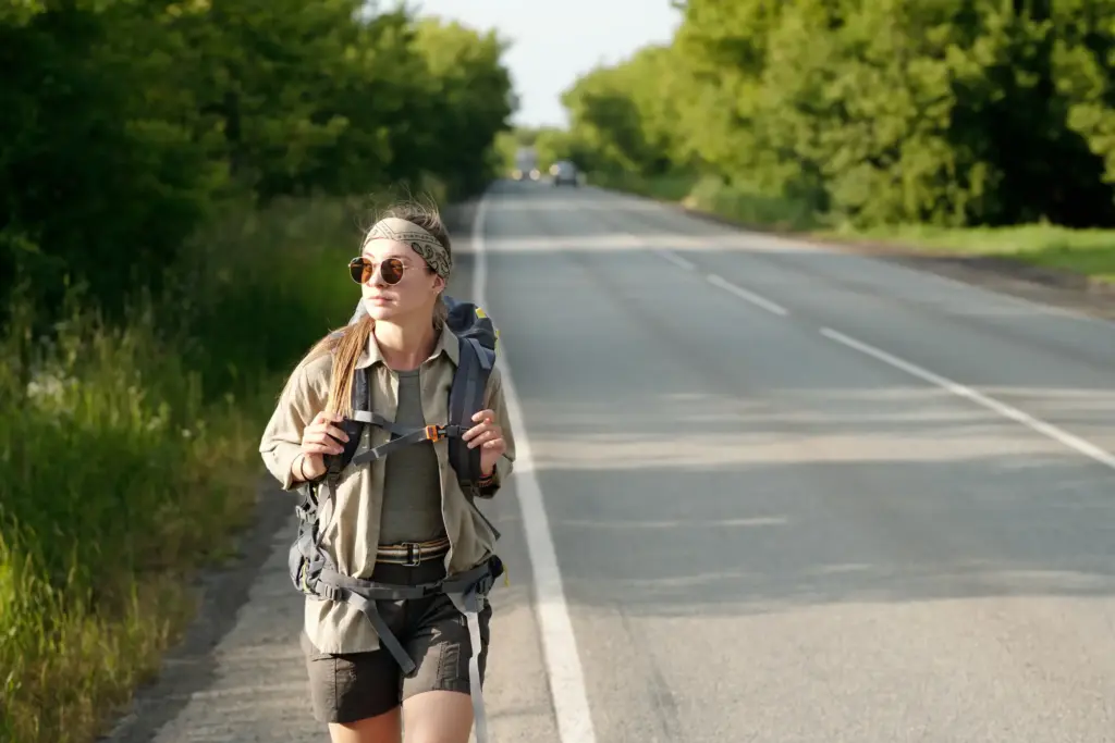 A woman walking on a freeway.