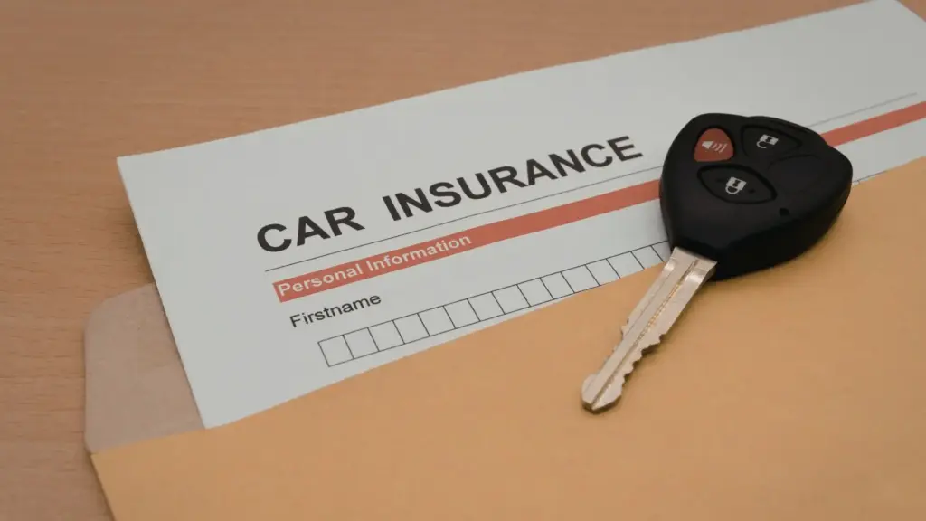 A car insurance form in a folder with a car key.
