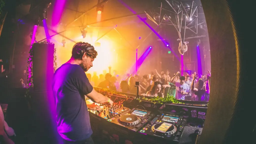 A Dj performing at a rave.