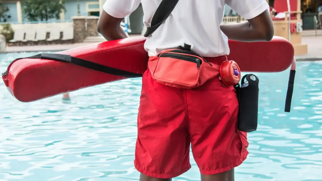 A lifeguard watching a pool.