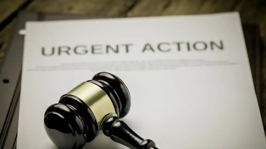 An urgent document with a gavel on top.
