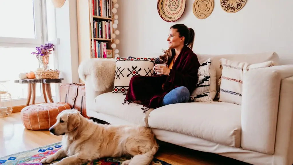 A woman and her dog taking it easy at home.