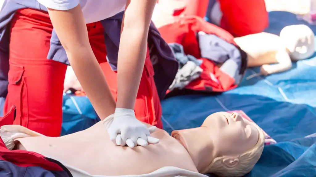 A person doing CPR training.