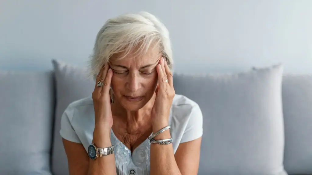 An old woman with a headache.