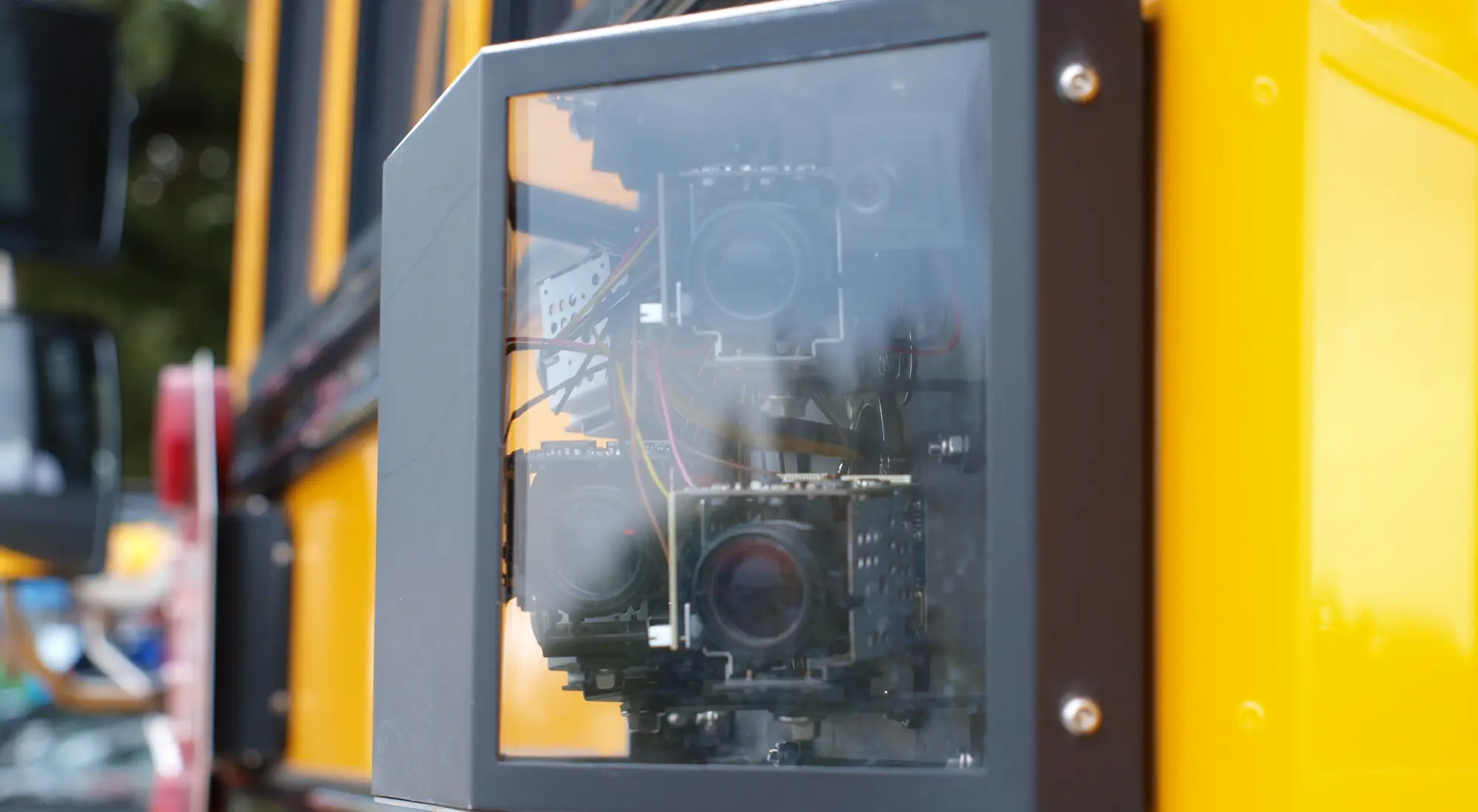A camera on a school bus stop arm.
