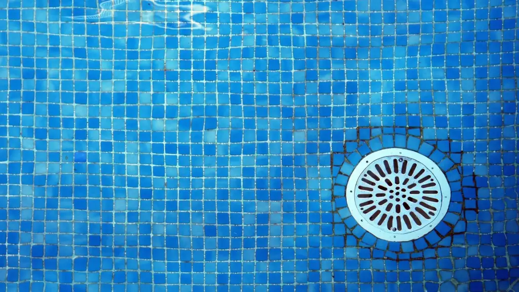 A close up of a pool drain.