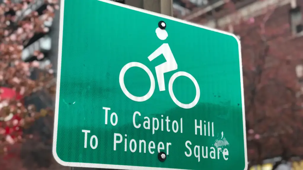 A sign telling bikers about a path Capital Hill.