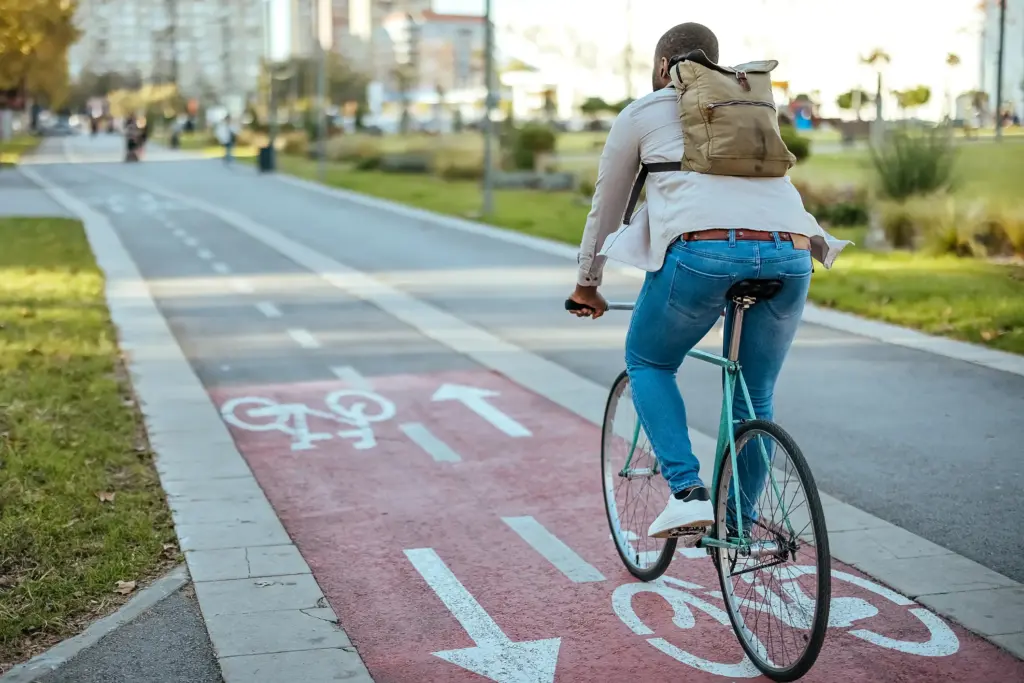 A bicyclist without a helmet in the bike lane.