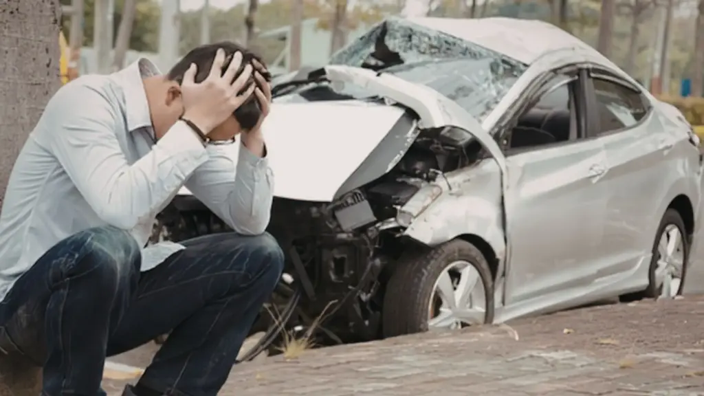 A man regretting his mistakes after a car accident.