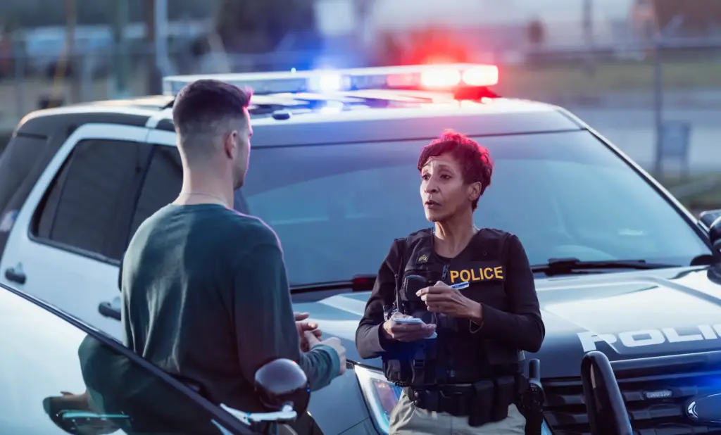 A police officer taking notes for a police report.