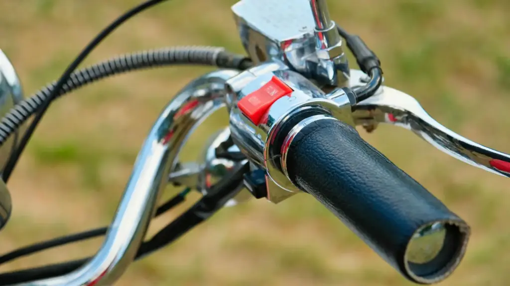 A closeup shot of a motorcycle handlebar.
