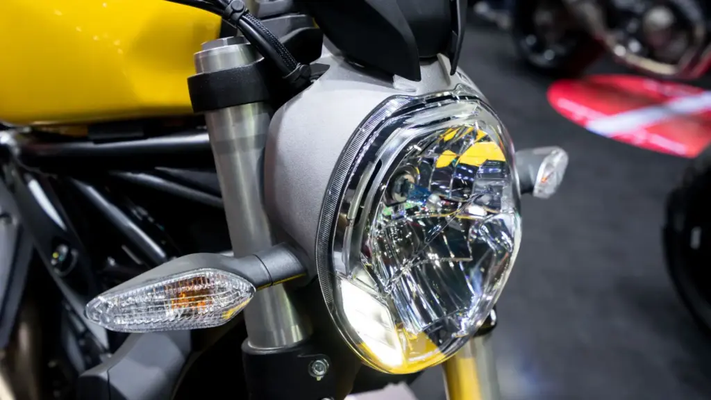 A closeup of a motorcycle turn signal.