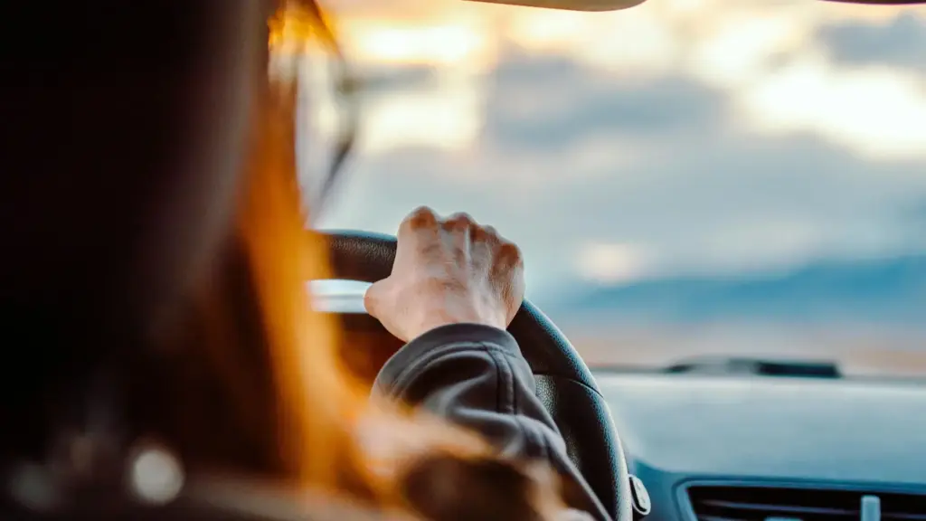 A woman driving a car.