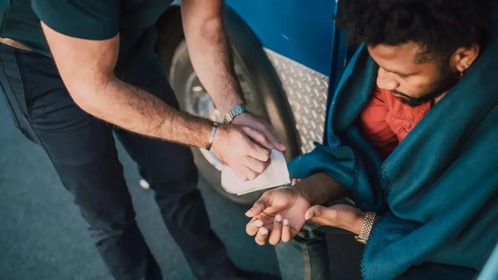 A person helping an injury victim.