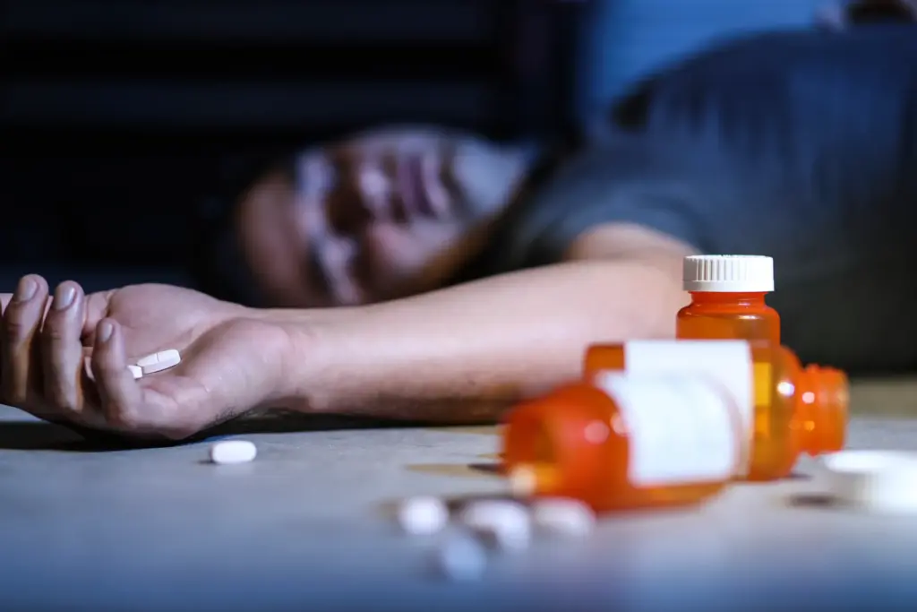A man overdosing on pills.