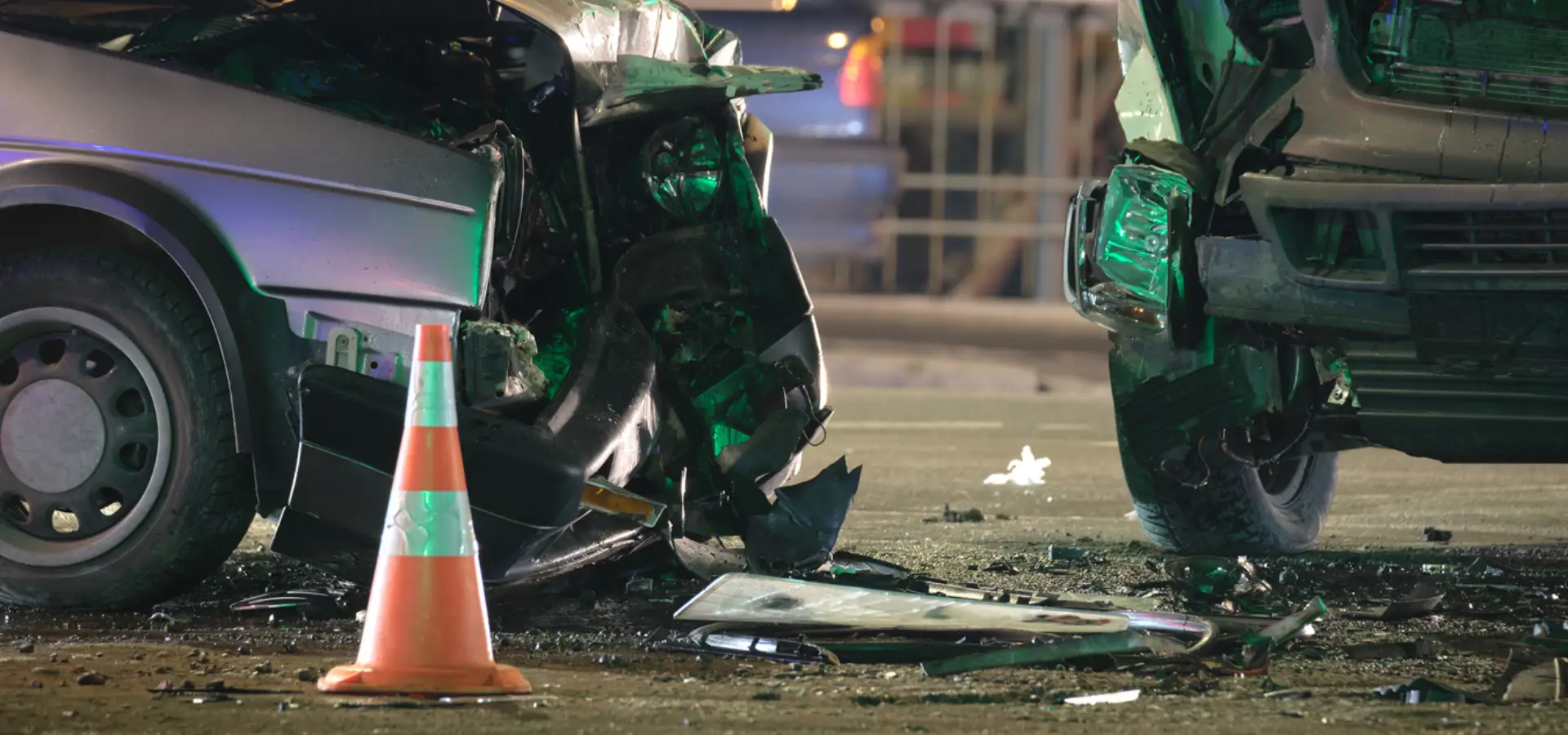 A close up of a car crash and debris.