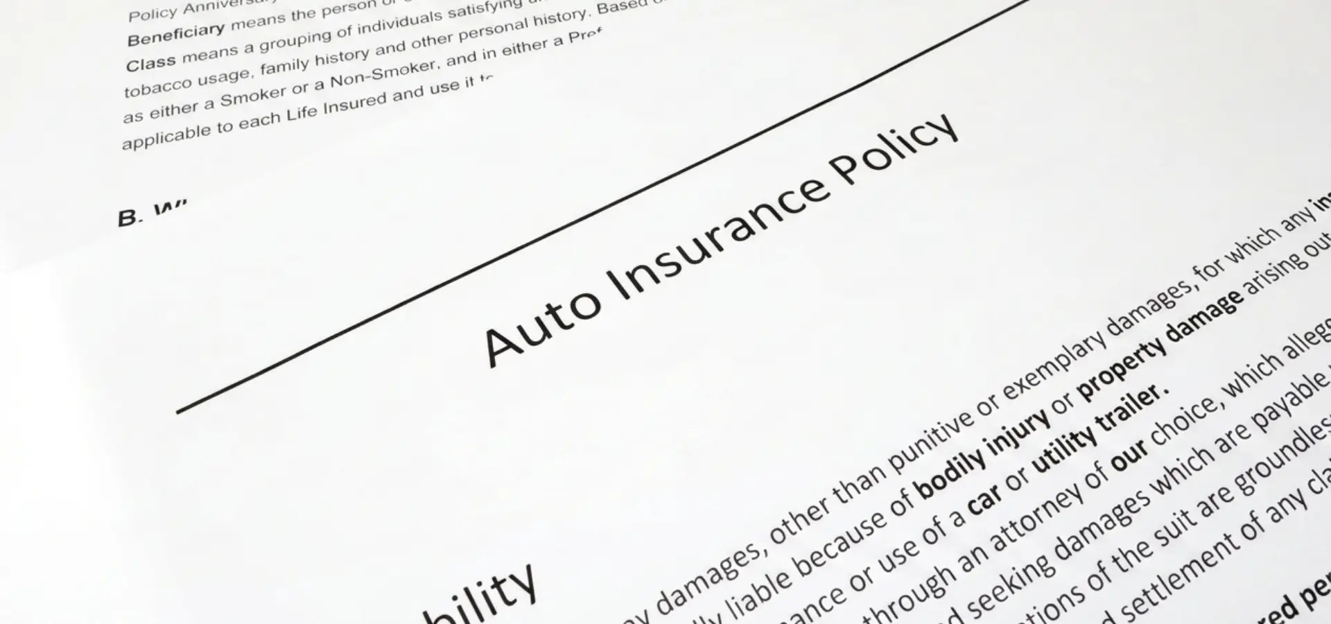 A close up of a car insurance policy.